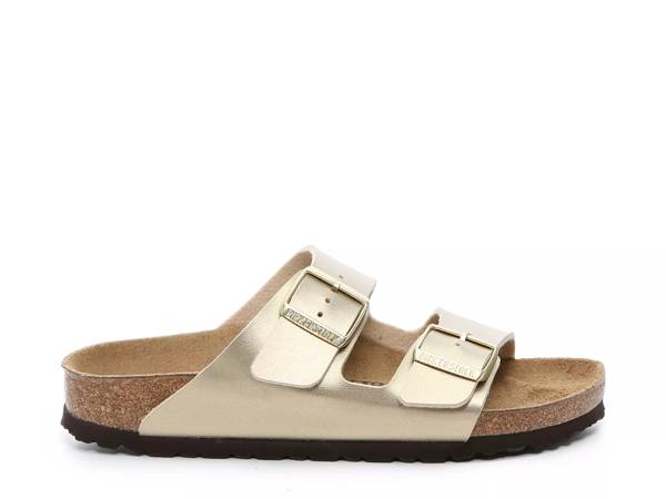 Featuring a gold Birkenstock sandal.
