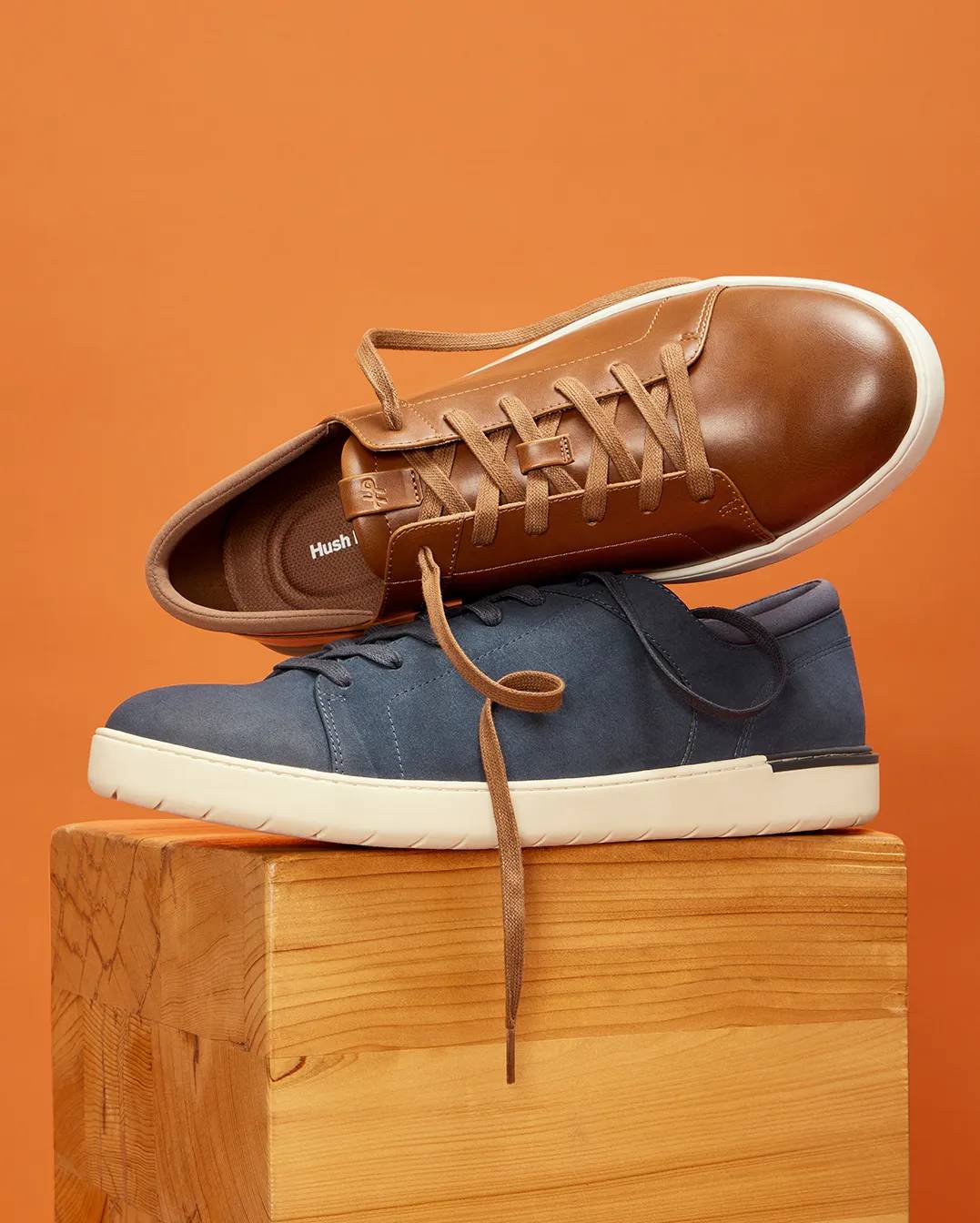 The men's Benji wide-width sneaker in Tan Leather stacked above the Benji Navy Suede Sneaker in medium-width.