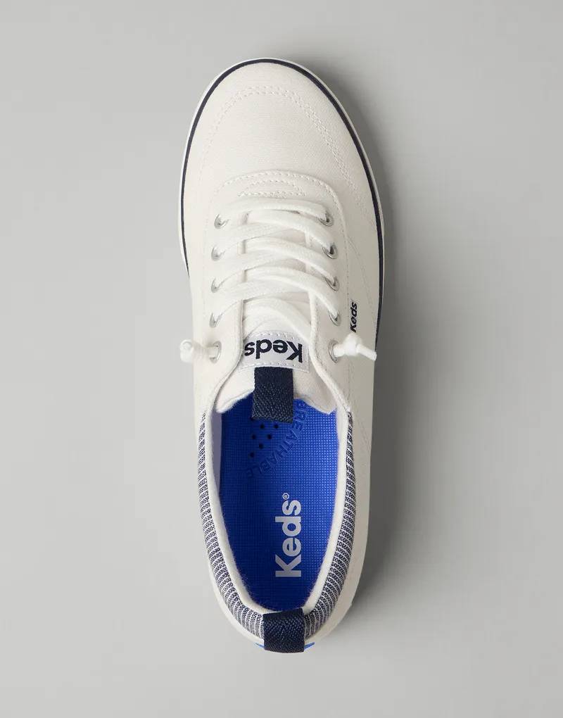 A top-down view of the Center III Canvas Slip-On Sneaker in white/navy.