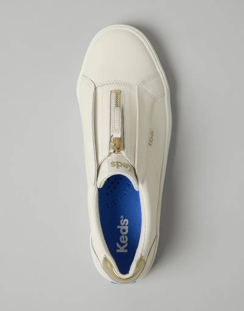 A top-down view of the Pursuit Zip Leather Sneaker in white.