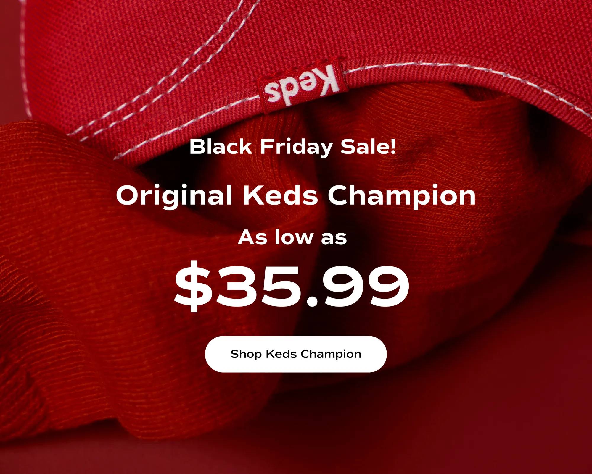 A close-up of the Keds Champion Originals in red canvas paired with a red sock. The text says Black Friday Sale! Original Keds Champion as low as $35.99. Shop Keds Champion