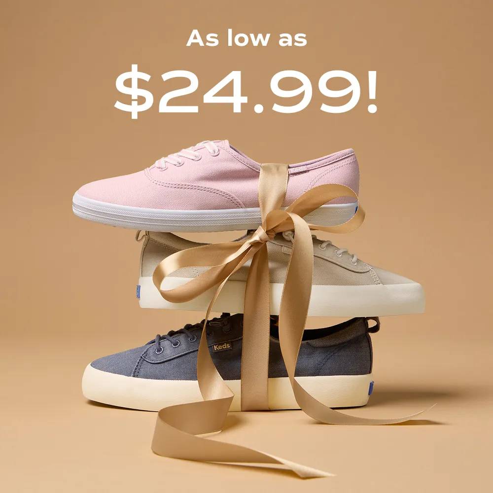 A light brown background with a stack of sneakers in navy, beige, and light pink tied with a satin ribbon. The text says as low as $24.99!