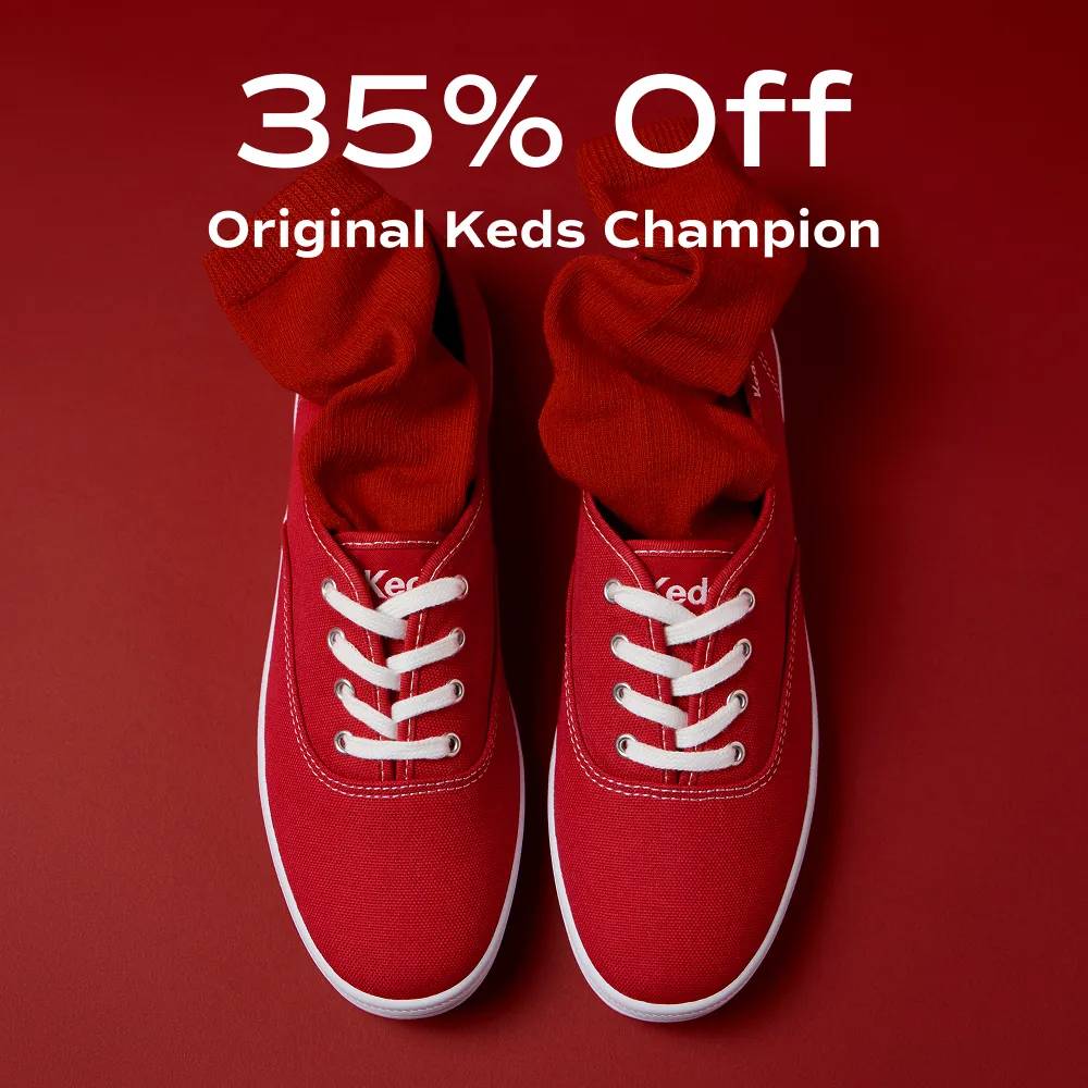 A red background featuring the Keds Champion Canvas Lace-Up in red and a red sock. The text says 35% Off Original Keds Champion