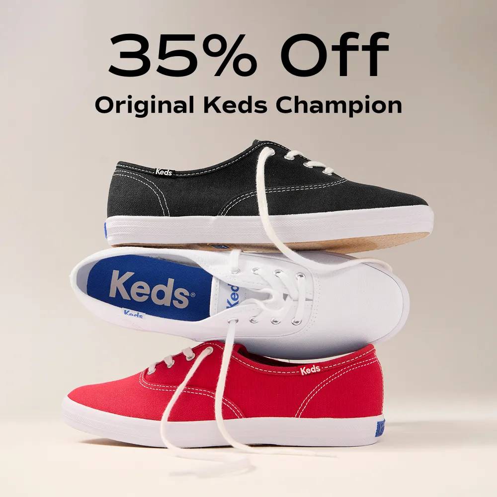 A stack of the Keds Champion Originals Lace-Up in red, white, and navy canvas. The text says 35% Off Original Keds Champion