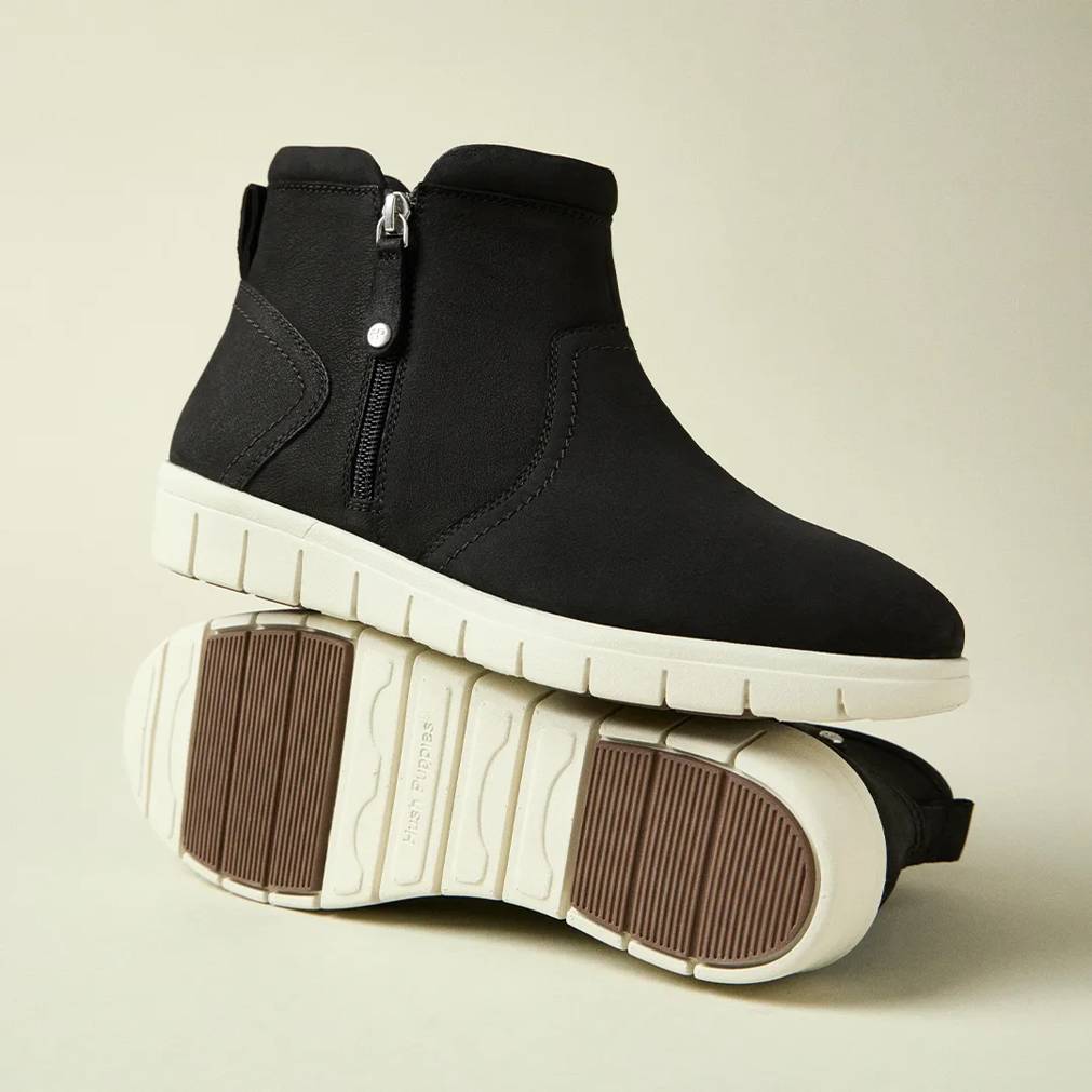 a pair of black and white winter boots