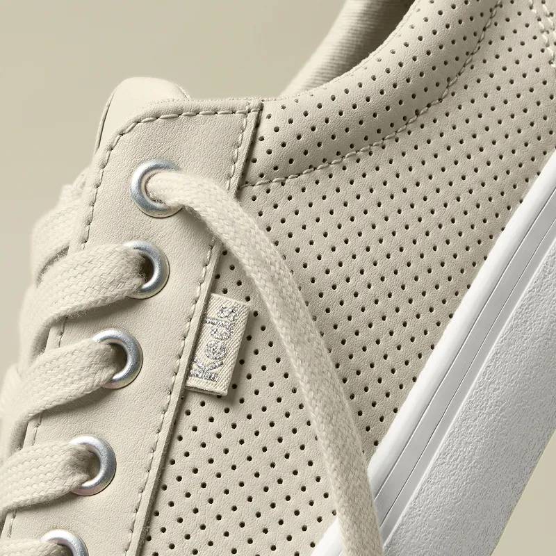 A close-up of the perforated leather on the Jump Kick Perforated Leather Lace-Up in oatmeal.