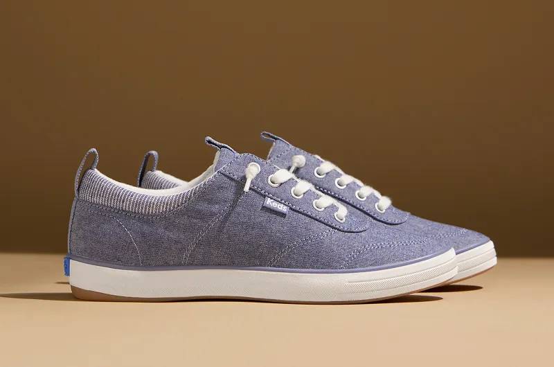 A side view of a pair of Center III Chambray Slip-Ons in blue. Shop Slip-Ons.