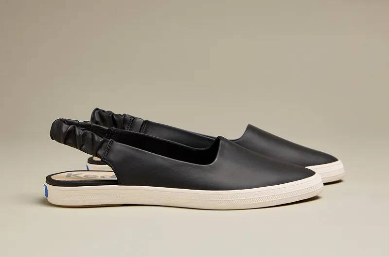 A side view of a pair of Remi Mid Zip Suede Faux Fur Booties in oatmeal. Shop Boots.