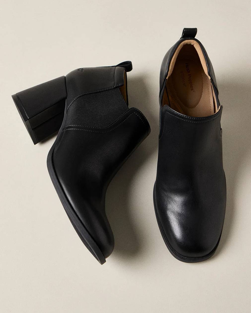 A pair of black leather booties