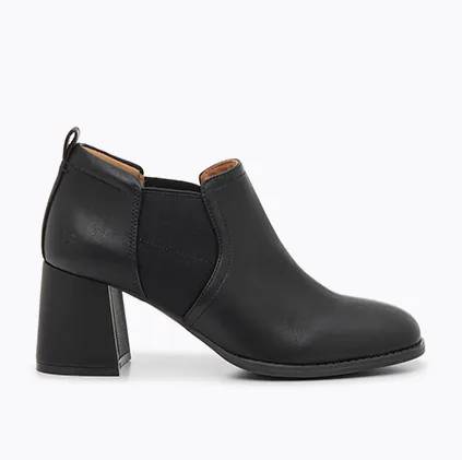 a side view of a women's tayta leather bootie in black