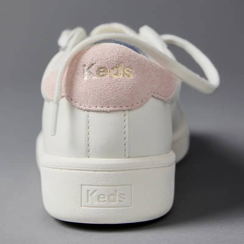 A close-up on the heel of the Ace II Leather Lace-Up in white showcasing the sneaker’s blush pink suede heel tab with gold foil Keds logo. Signature Styles. Favorites for a reason. Shop Best Sellers.