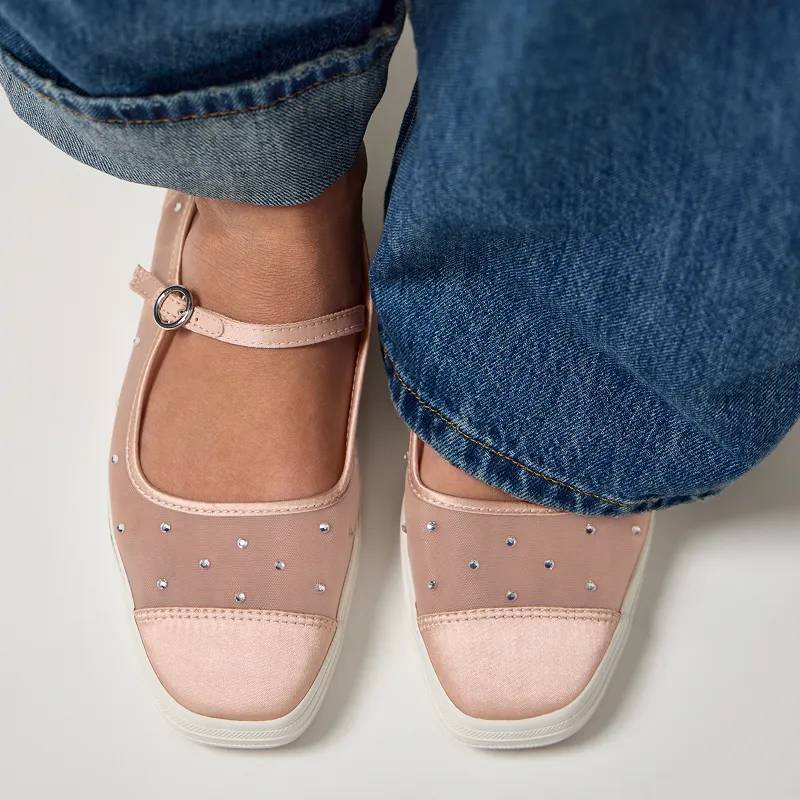 The Square Toe Mary Jane Sheer Mesh Jewels in peony pink paired with blue jeans.