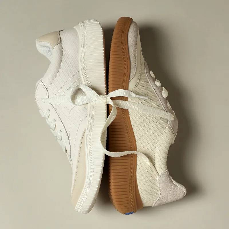 The Contest Perforated Leather/Suede Lace-Up in oatmeal taupe positioned back-to-back with the Contest Perforated Leather Lace-Up in snow white/oatmeal.