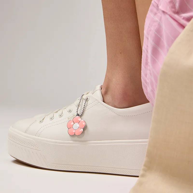 The Skyler Leather Daisy Charm Lace-Up in snow white positioned on foot.