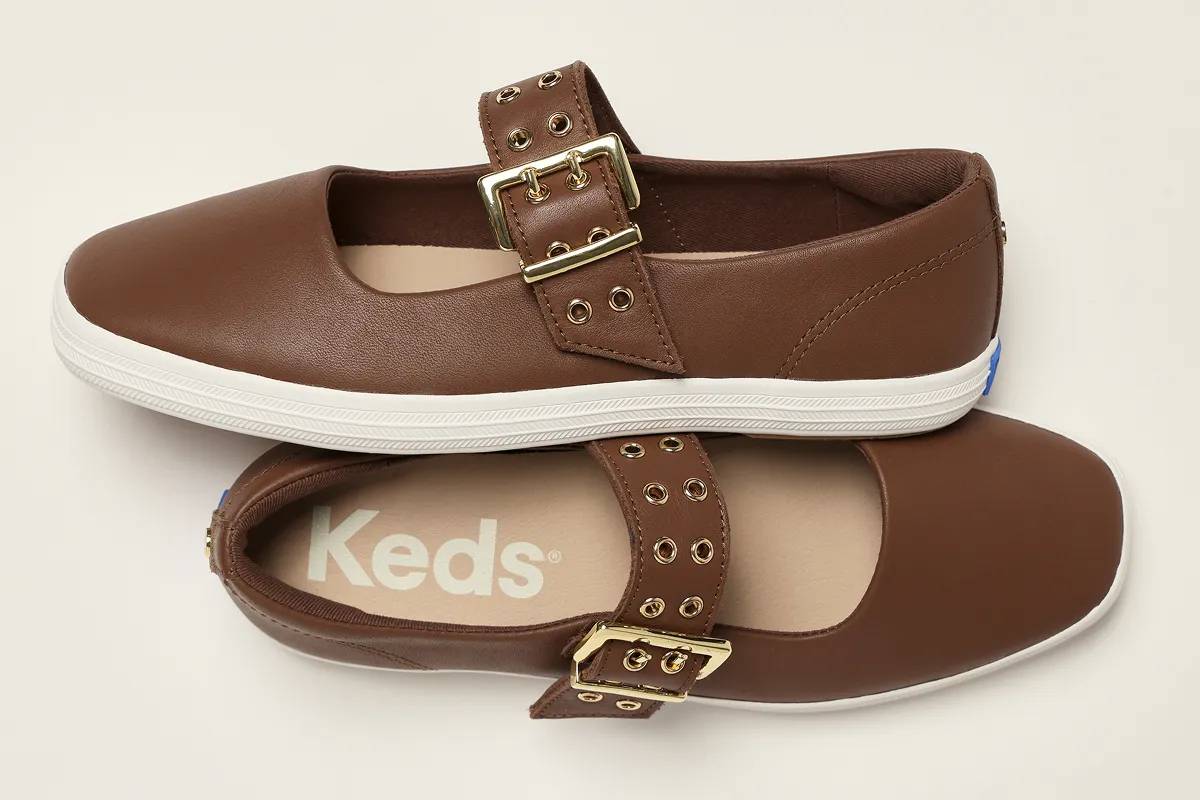 A pair of the Square Toe Mary Janes in black facing opposite directions.