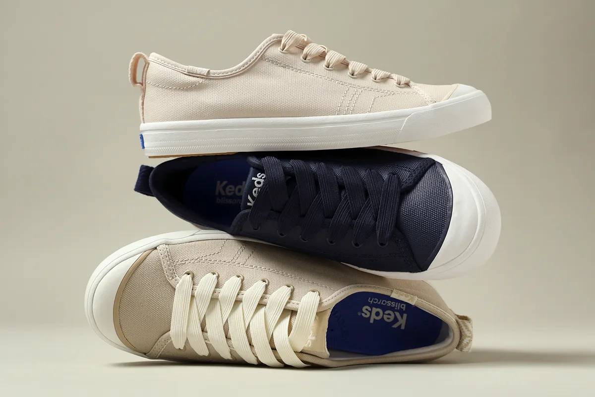 A stack of the exclusive Cruise Canvas and Coated Canvas Slip-Ons in three colors.