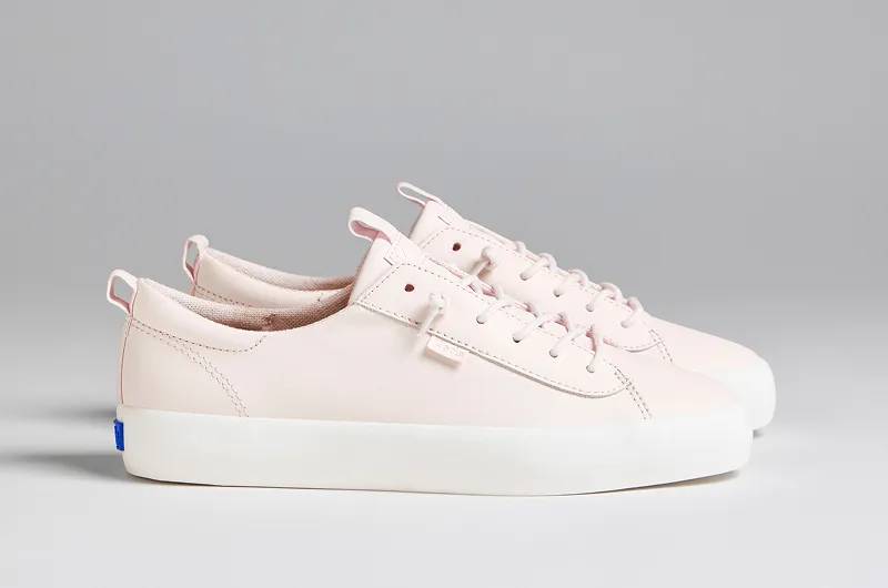 A side view of a pair of Kickback Leather Slip-Ons in blush. Shop Leather.