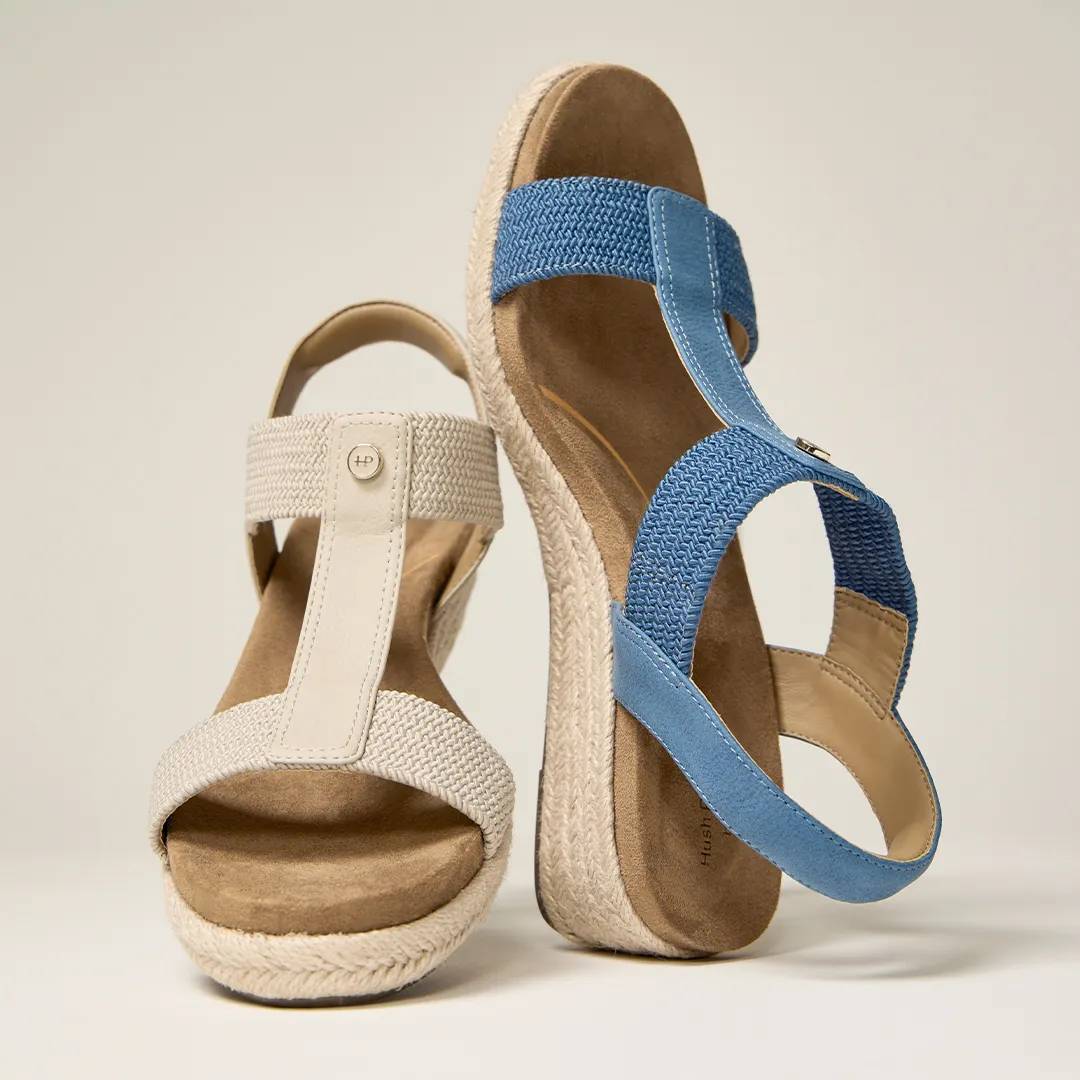 a pair of white and blue sandals for vacation