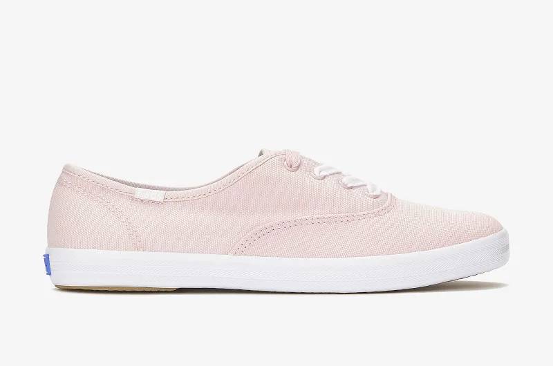 A side view of the Keds Canvas Champion Lace-Up in Icy Pink. Shop Now.