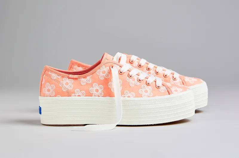A side view of the Triple Up Canvas Floral Embroidery Lace-Up in neon coral. Shop Platforms.
