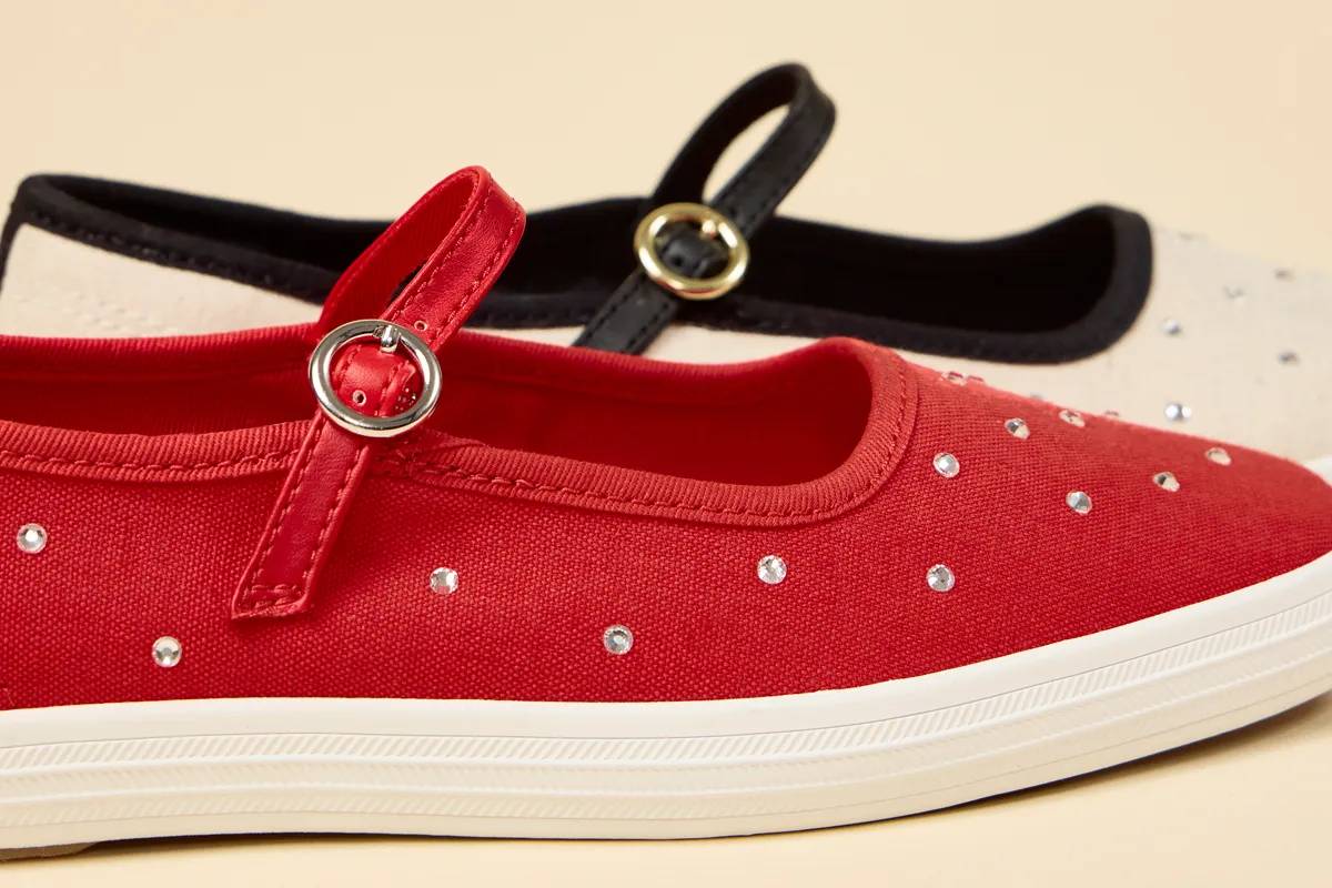 A closeup of two Square Toe Mary Jane flats—one in red and the other in natural/black—showcasing the round metal buckle on the adjustable strap and the rhinestone embellishments on the upper. Ballet Style, Sneaker Feel. Shop Sneakerinas.