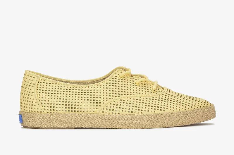 A side view of the Keds Champion Point Low Wave Perf Leather Lace-Up in yellow.