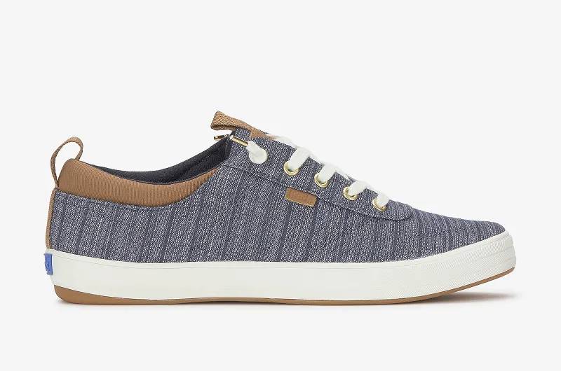 A side view of the Center III Stripe Chambray Slip-On in blue/cognac.