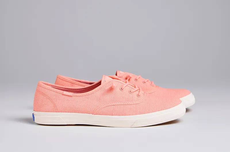 A side view of the Rillax Champ Chalky Canvas Slip-Ons in neon coral. Shop Canvas.
