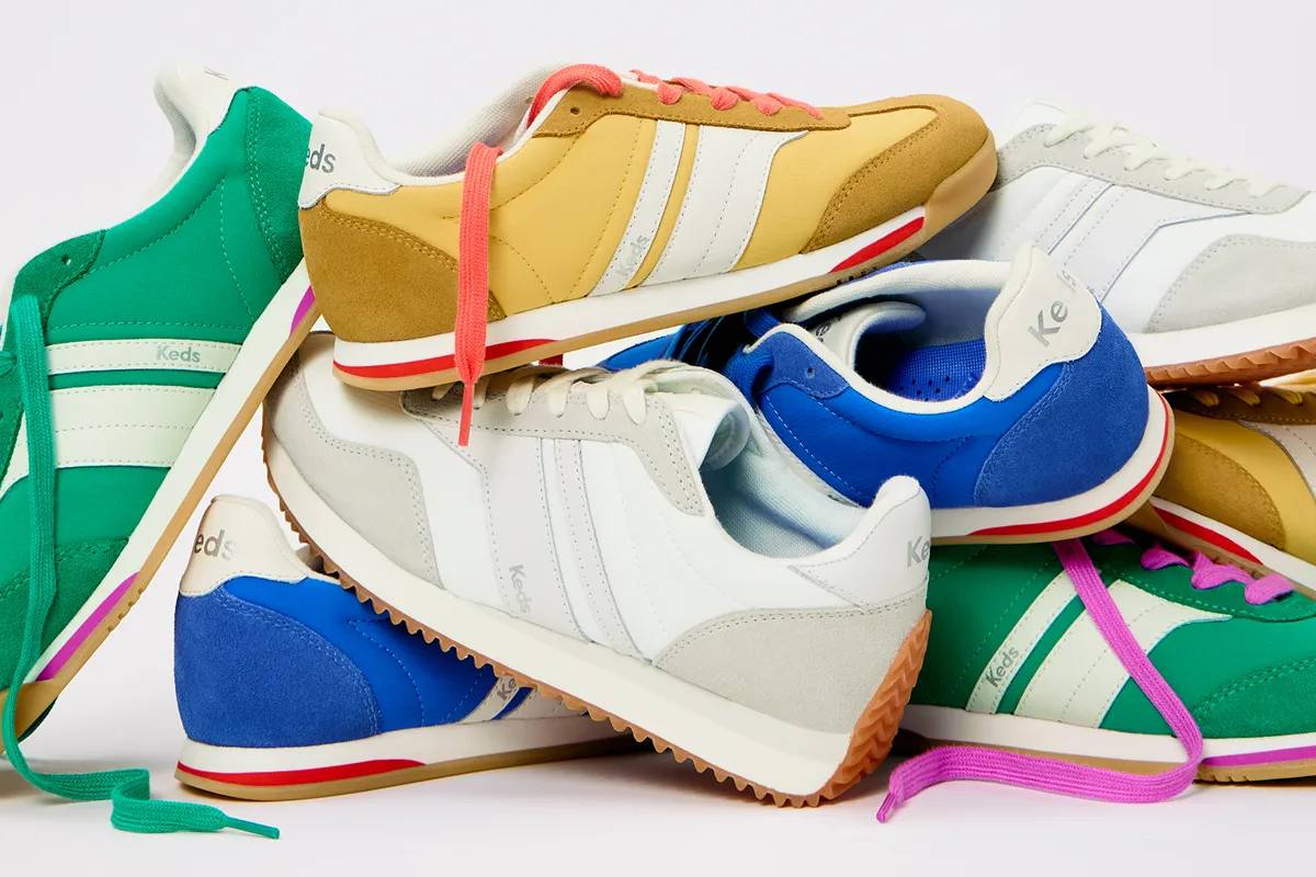 An artfully arranged pile of new colors of the Revival Lace-Ups including snow white/light grey, yellow, green, and Keds blue.