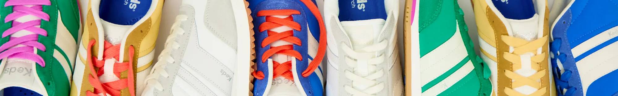 Retro Sneakers: A variety of brightly colored retro-inspired sneakers in a pile including the Rena runner and the Revival T-toe.