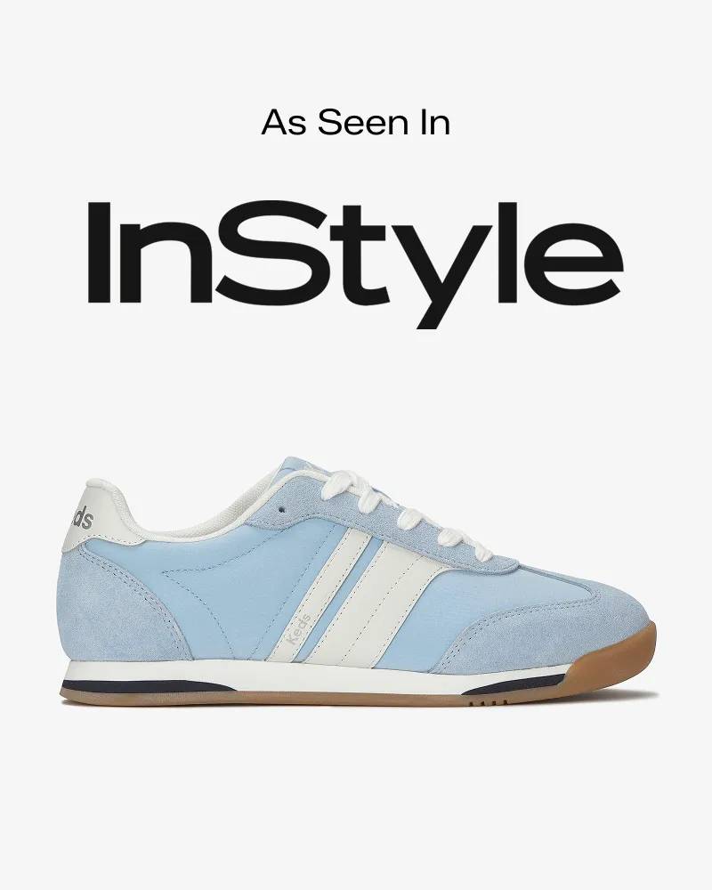 Text that says As Seen In sits above the InStyle logo. Below is a product image of the Revival Nylon/Suede/Leather Lace‑Up sneaker in light blue with white stripes. Text below reads Revival Lace‑Up. The colorful sneaker of the moment. Shop Now.