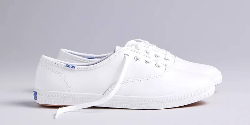 A side view of the Original Keds Champion Leather Lace-Up in white.