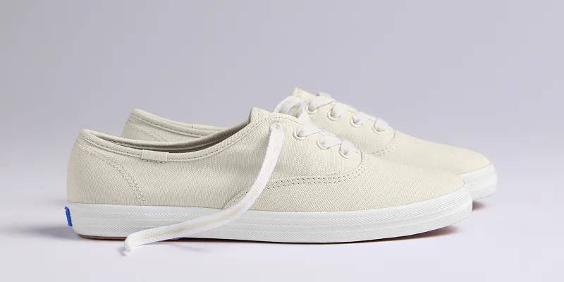 A side view of the Keds Champion Canvas Lace-Up in oatmeal.