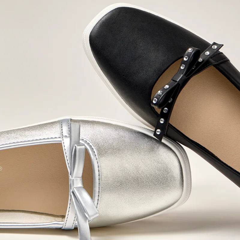 Two colors of the Square Toe Mini Bow Mary Jane flats, one in silver metallic leather and the other in black leather with a metal studs on its bow. Corresponding text says Topped With a Bow. With a touch of feminine flair. Shop Mini Bow Mary Jane.
