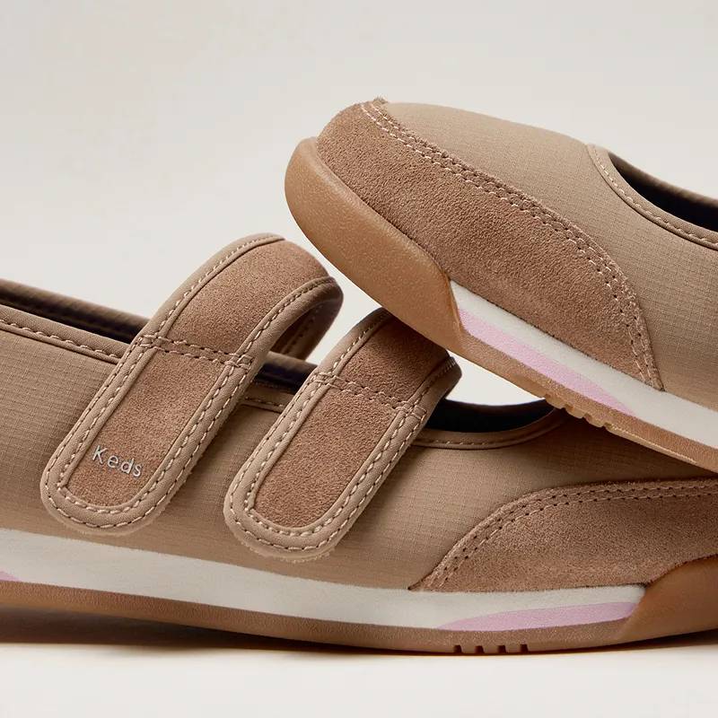 A closeup on a pair of Revival Mary Jane Nylon/Suede sneakers in mocha, one shoe sitting on top of the other. Corresponding text says Retro Revival. Archival hits reimagined. Shop Retro.