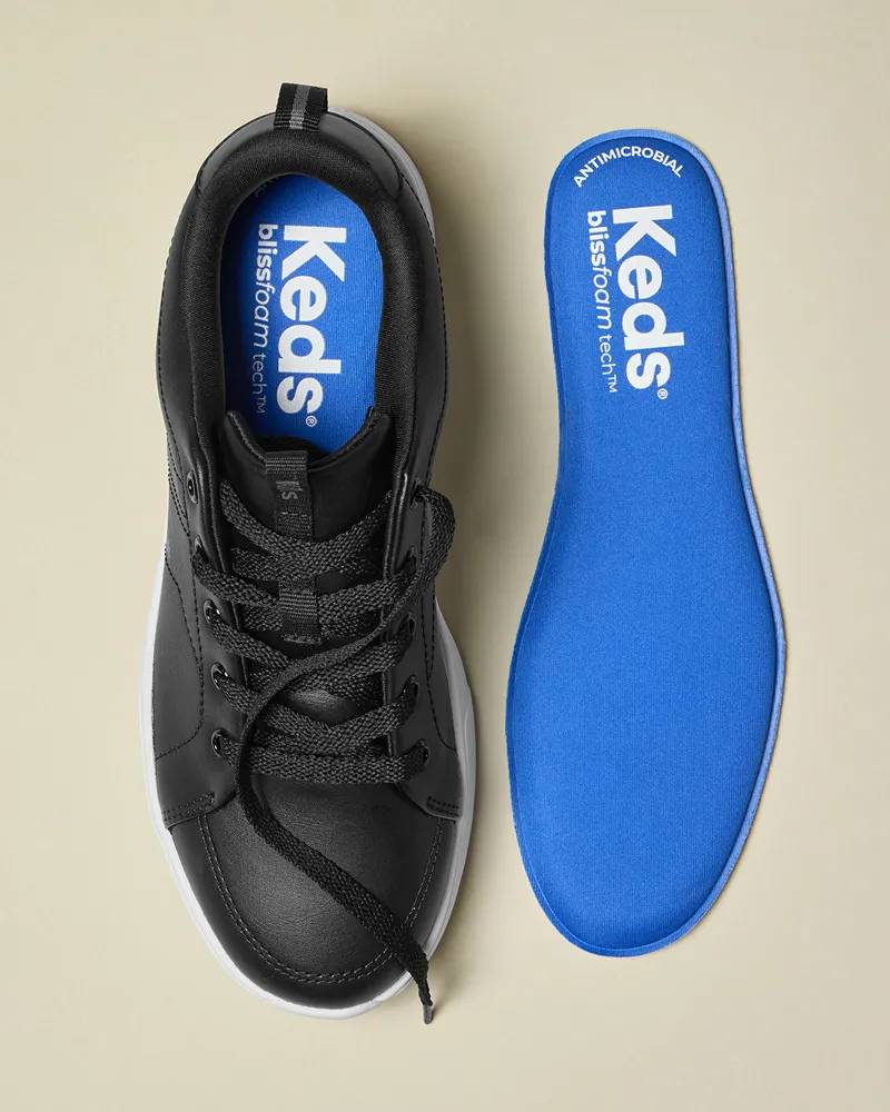 An overhead view of the BlissWalk Lace-Up in black on the left and the BlissArch footbed on the right.