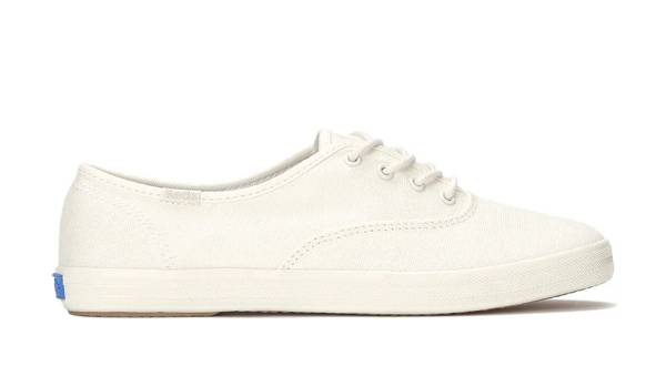 A side view of the Keds Champion Canvas Water Repellent Lace-Up in snow white.