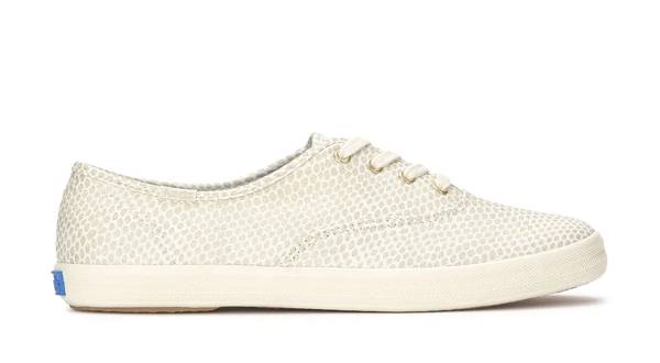 A side view of the Keds Champion Metallic Foil Canvas Lace-Up in egret/champagne.