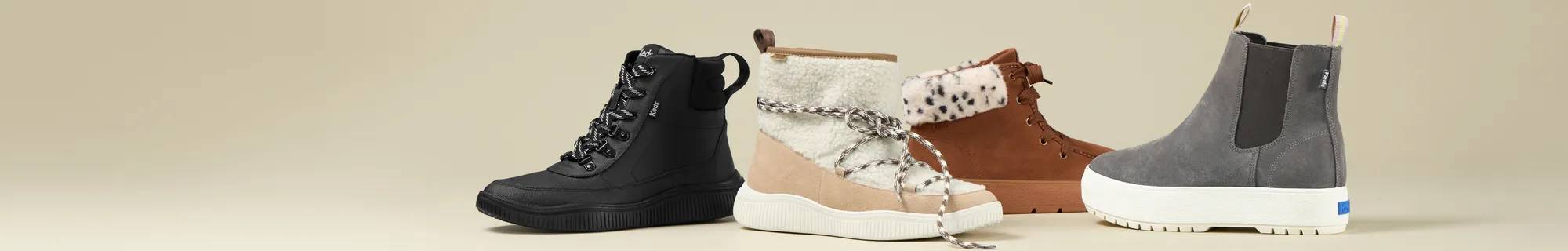 Best in Boots. A beige background with a spread of the Nova Coated Canvas/Nylon Lace-Up Boot in black, the Nova Faux Shearling/Suede Slip-On Boot in natural/Cuban Sand, the Explore Bootie in brown suede, and the Platform Chelsea Lug in grey suede.