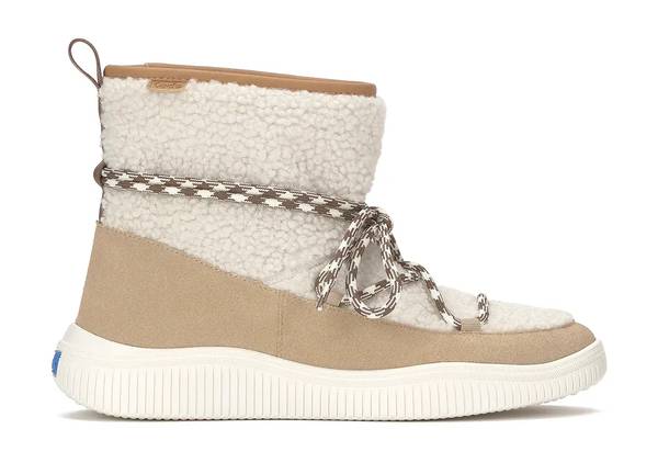 A side view of the Nova Boot Slip-On Faux Shearling/Suede in natural/Cuban sand.