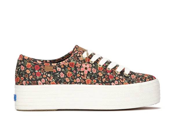 A side view of the Triple Up Ditsy Rose Canvas Charm Lace-Up in multi.
