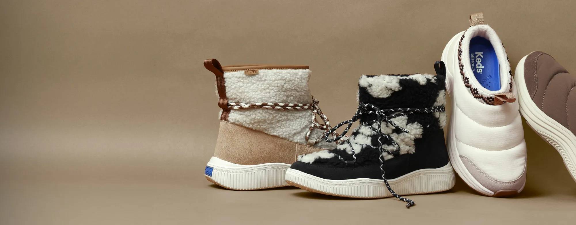 A sand-colored background with an array of cozy styles, including the Nova Slip-On Boot and the BlissMove Clog.