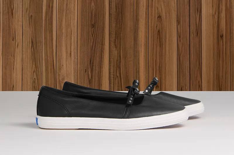 A side view of the Square Toe Mini Bow Leather in black.