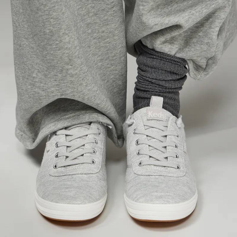 The Center III Sweatshirt Jersey Slip-On in light grey paired with wide-leg sweatpants and dark grey socks.