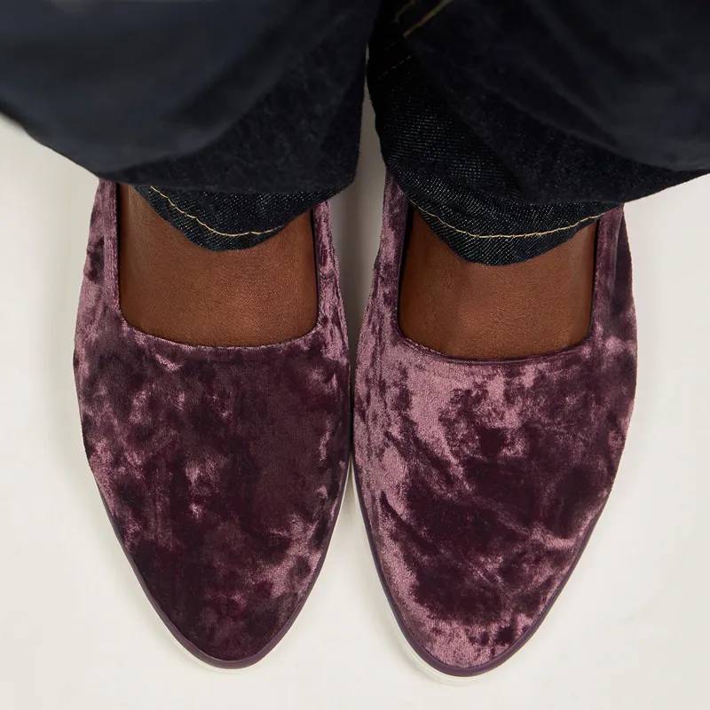An overhead view of the Point Toe Crushed Velvet Slingback in fig paired with dark denim.