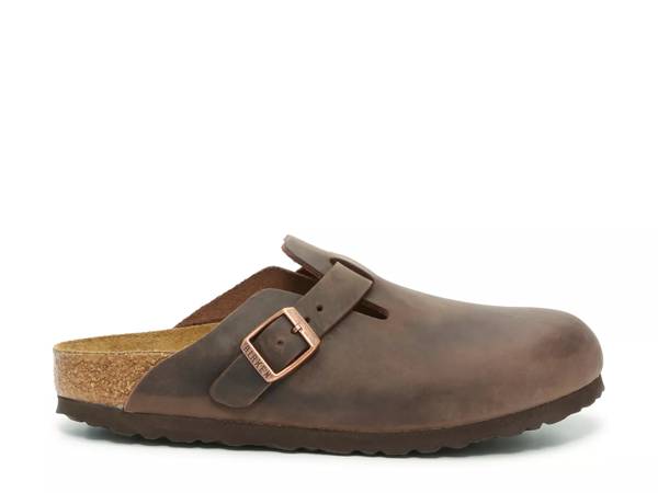 Featuring a brown Birkenstock clog.