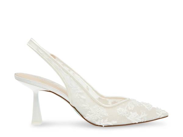 Featuring a white Betsey Johnson pump.
