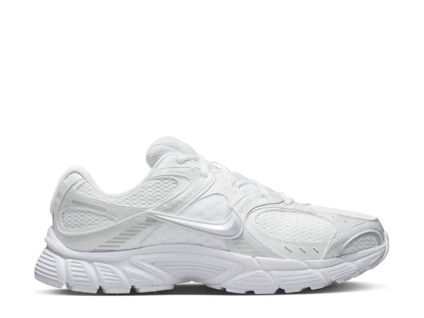 Featuring a pair of white Nike sneakers.