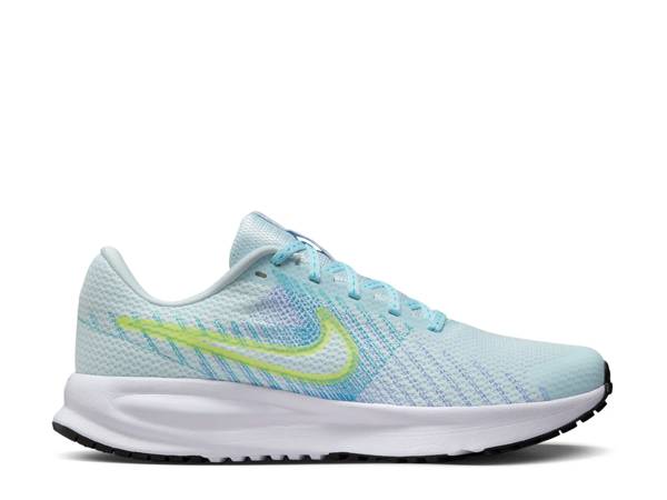 Featuring a pair of blue and green Nike running shoes.