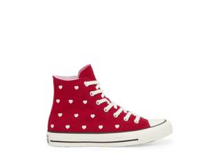 Featuring a girl's red converse with white hearts.